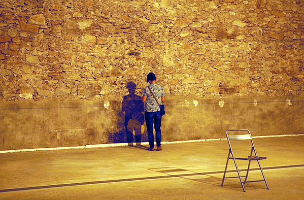 Visitor reading writing on the floor